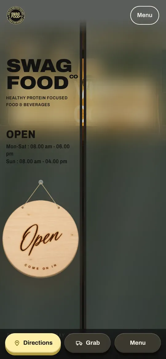 Swag Food Co site on a phone: the café door with an Open sign under the Swag Food Co logo